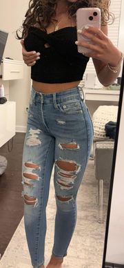 000 distressed medium wash high rise jeans