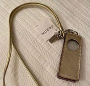 Y2K Coach iPod shuffle case with golden strap.