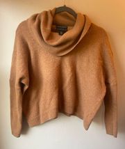 100% wool cropped sweater in a caramel color long sleeves turtleneck style