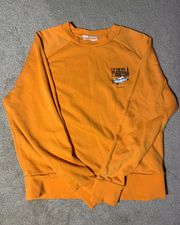 Graphic bright orange sweater