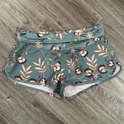 Women’s size small green floral  board shorts