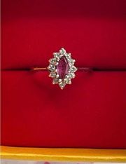 14K size 6 white gold ruby and diamond ring.