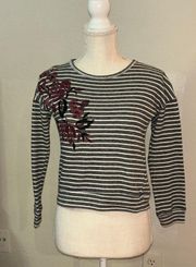 size women’s extra small, gray and white striped sweatshirt with floral stitching