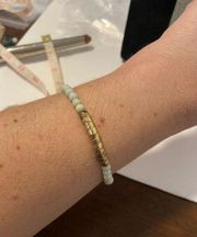 Vintage off white bead and gold tone bracelet