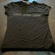 medium black tshirt with silver spelling out  in medium. GUC.