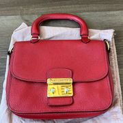 Sound Lock Leather Crossbody in red with gold hardware