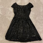 Delia’s black sequin dress