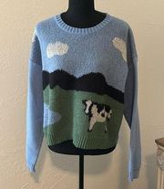 Cow in meadow sweater