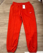 swoosh red/orange sweatpants