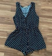 Black and white polka dot romper in good condition, size M.