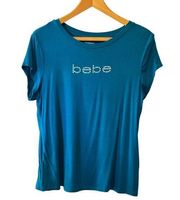 Bebe Turquoise Blue Tee with Silver Sparkle Logo—Size Large