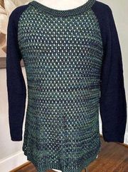 s green and blue crochet sweater