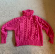 Pink turtleneck sweater