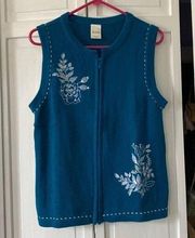 Zip up blue floral embroidered sweater vest.