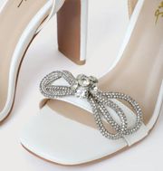 White rhinestone bow heel sandals