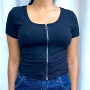 Black t-shirt with a zipper in the front.