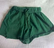 green sweat shorts