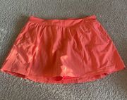 Crane bright orange tennis skirt