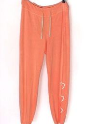 Sundry neon orange hearts sweatpants Medium NWOT