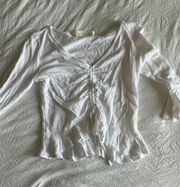 white ruffle shirt