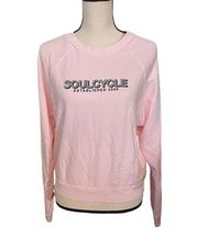 Soul Cycle light pink large crop sweatshirt.