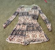 Light pink and purple patterned long sleeve romper with lace back never worn 