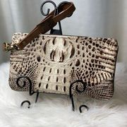 Large metallic bronze and cream wristlet. Alligator print on front. Leather