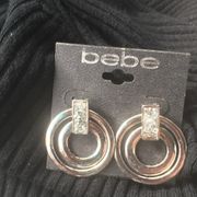 Bebe earrings circular rotating w rhinestones