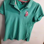 Polo size large green golf shirt, pink trim pink polo pony on the front 3 button