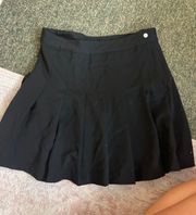 black pleated skirt