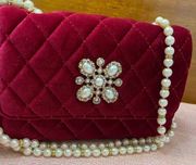 Sondra Robert’s quilted red velvet bag amazing faux pearl and rhinestone strap