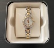 BY FOSSIL-TWO TONE WATCH Beautiful gold and silver tone stainless steel watch with little diamond rhinestones, excellent condition, I have attached a video showing the watch works great.