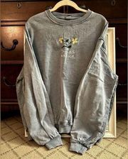 Urban Outfitters distressed blue crewneck sweatshirt w embroidered flowers  L
