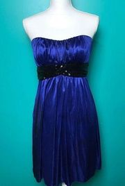 Blue satin strapless dress.