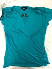 BCX women’s top. Teal size medium cross front style. Short sleeves