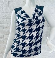 Valerie I was size 1XSleeveless   Black and white print blouse   Featuring faux leather with metal dots on the shoulder.   banded waist