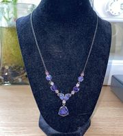 purple stone necklace with dark metal