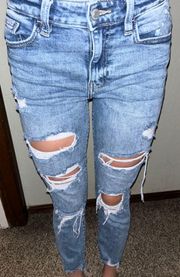 Buckle Distressed Skinny Jeans