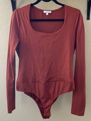 Boutique  rust long sleeve bodysuit