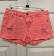 Bright coral pink distressed shorts 