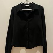 Black structured blouse with slits on sleeves