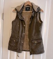 Olive Vest with Faux  Fur Lining. In perfect Condition No flaws Noted.