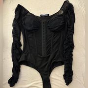 AKIRA lace corset bodysuit. Ruched sleeves, unhooks in front. Size S