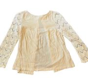 Womens cream blouse with crotchet sleeves and button down back