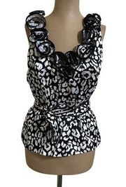 Jackie Jon black and white sleeveless blouse with rosette neckline size 10