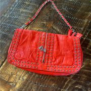 Vintage orange small leather bag. Zipper and stud details. Great condition.