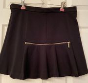 Michael  Black mini skirt with gold zipper in front & back size 8