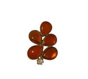 Repaired vintage orange glass brooch with crystal stud