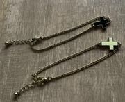 Urban Outfitters Ivory and black cross charm gold bracelets set