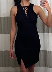 black bodycon dress with lace up neckline and asymmetrical off set hem